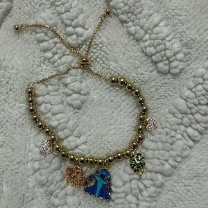 Gold-Tone Charm Bracelet with Blue Stitch Enamel Charm